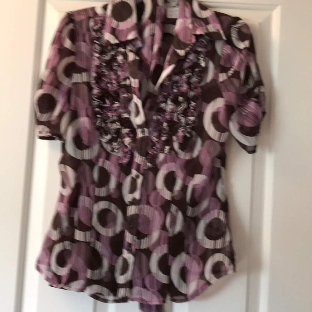 Beautiful top with built in cami and belt.